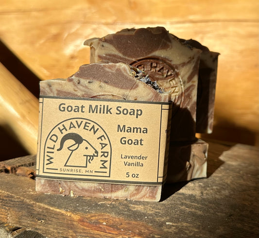 Bar of brown and cream swirled soap with lavender blossom inclusions