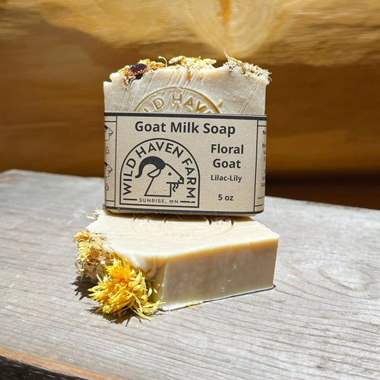 Uncolored bars of soap with flowers on top